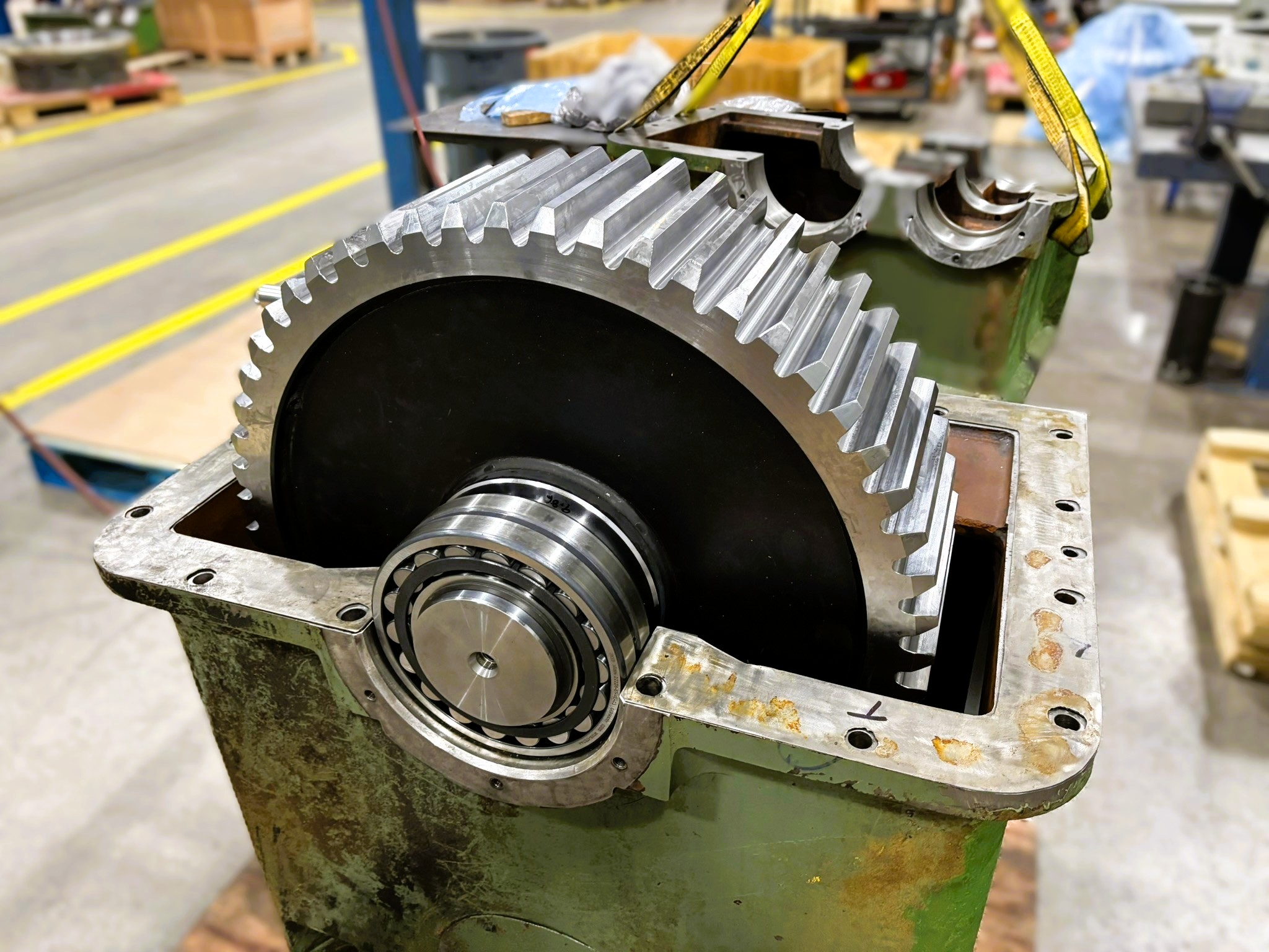 Large industrial gear assembly being repaired
